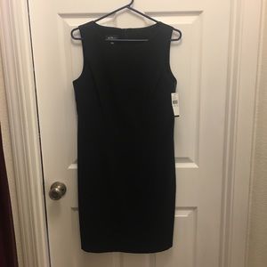 Sleeveless black sheath dress